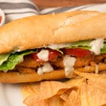 Buffalo Soy Curl Sub sandwich with baked tortilla chips and salsa