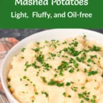 Bowl of Vegan Roasted Garlic Mashed Potatoes with chives sprinkled on top and Pinterest title