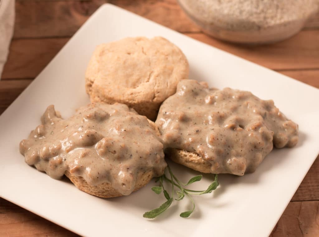 Square plate with vegan biscuits and gravy
