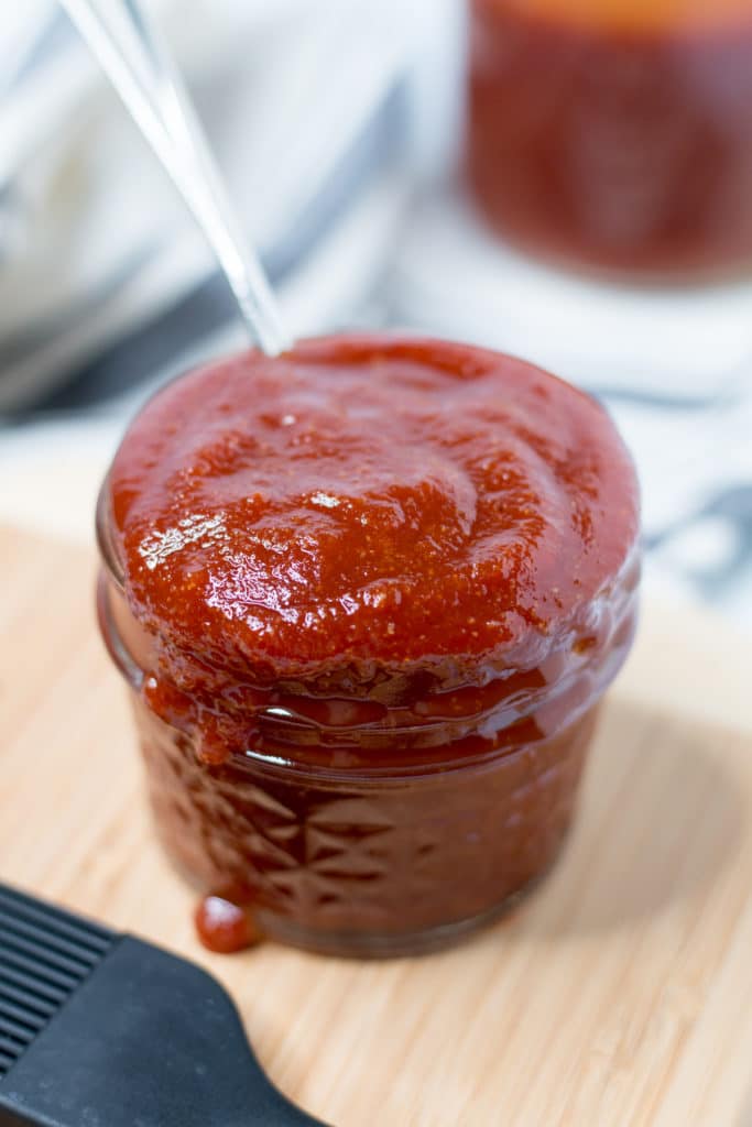 Jar of BBQ Sauce with spoon in it