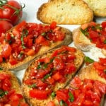 Closeup of tomato basil topping on bruschetta