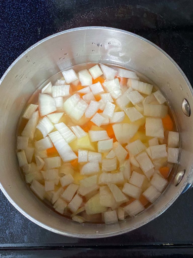 Pot of diced potatoes, carrots, onions