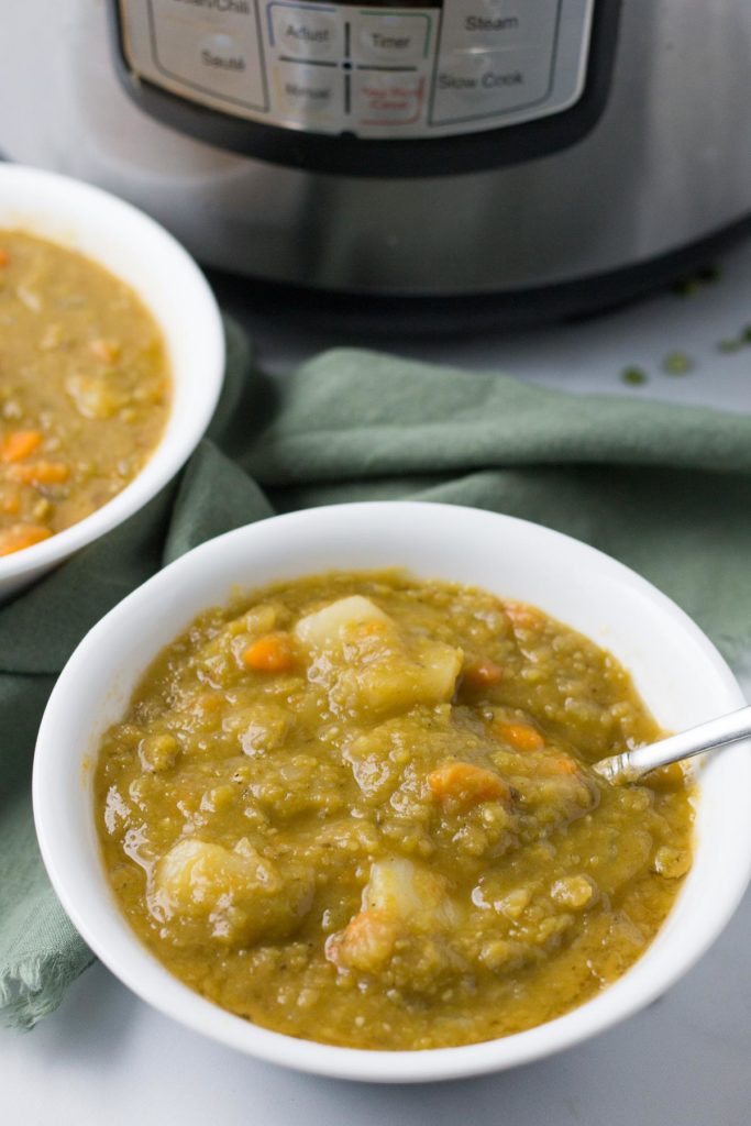 Bowl of Split Pea Soup in front of Instant Pot.