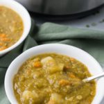Two bowls of split pea soup on green hapkin in front of split pea soup