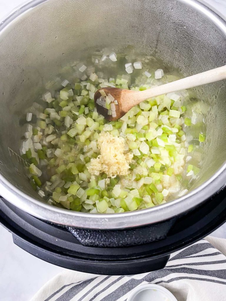 Garlic added to veggies sauteing in Instant Pot