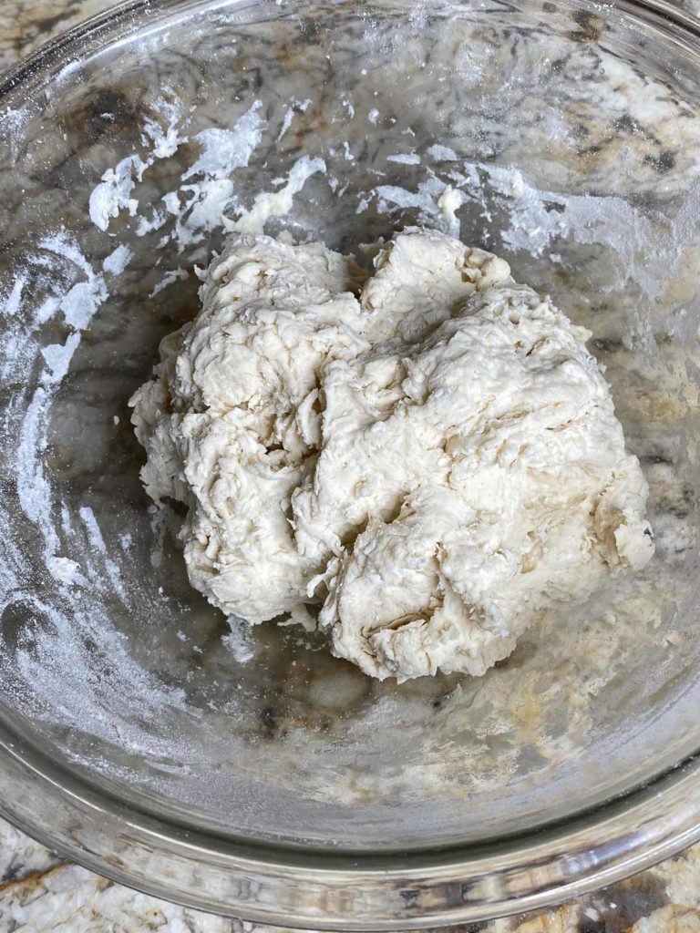 Tortilla dough in glass mixing bowl