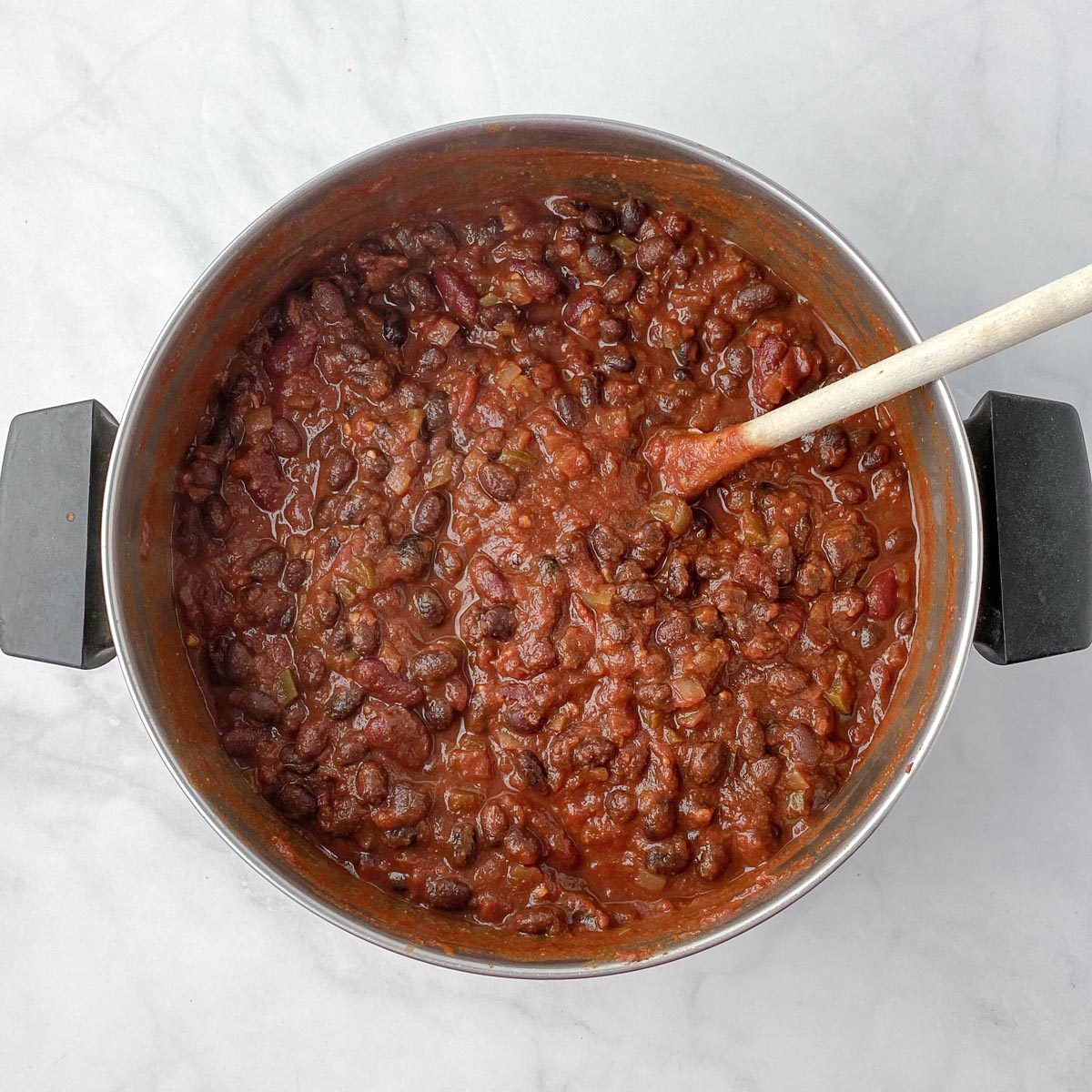 Cooked vegan chili in stainless steel pot