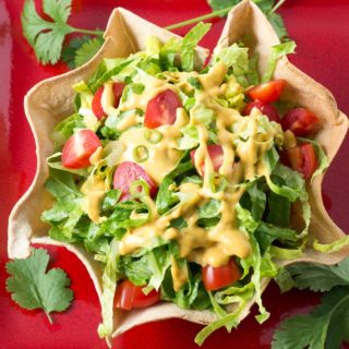 Overhead shot of vegan taco salad ona red plate