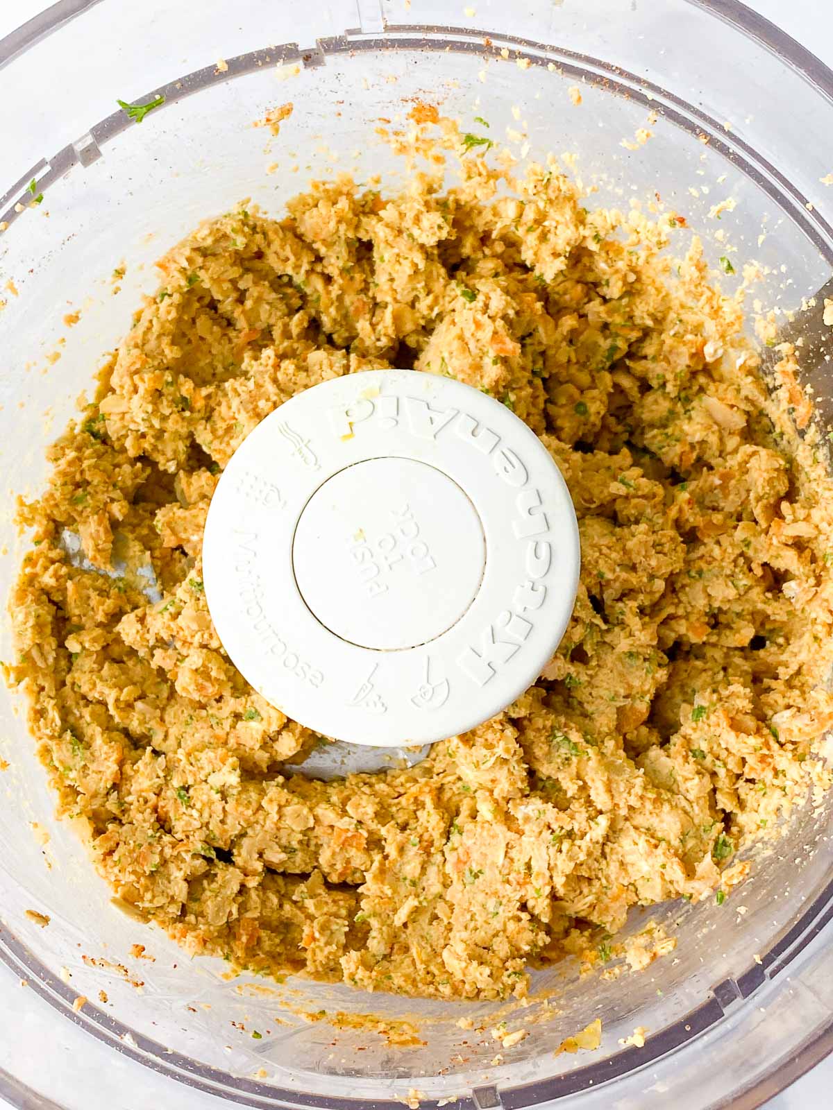 Chickpea burger ingredients blended in a food processor.