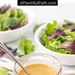 Image of jar of salad dressing with bowls of salad in background and Pinterest title above it.