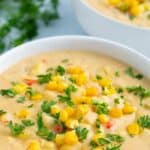 Image of vegan corn chowder with Pinterest text above it.