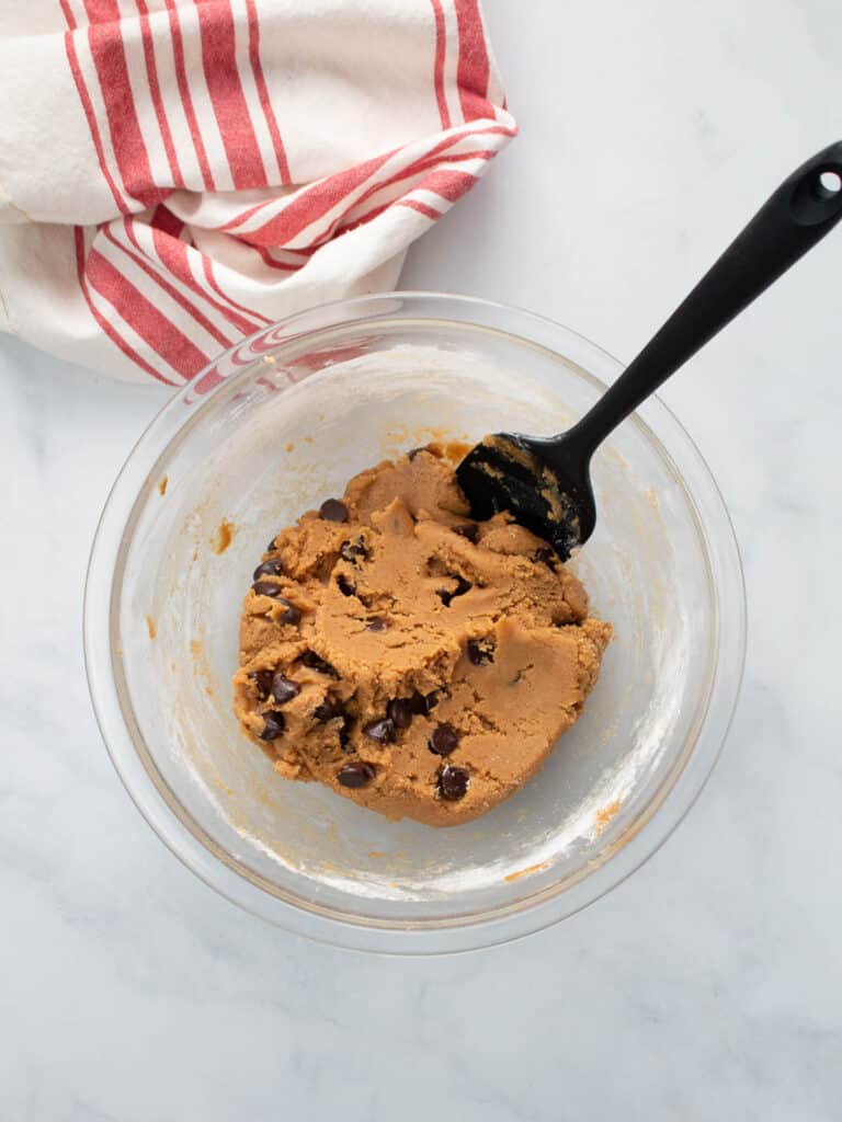 Chocolate chips stirred into cookie dough.