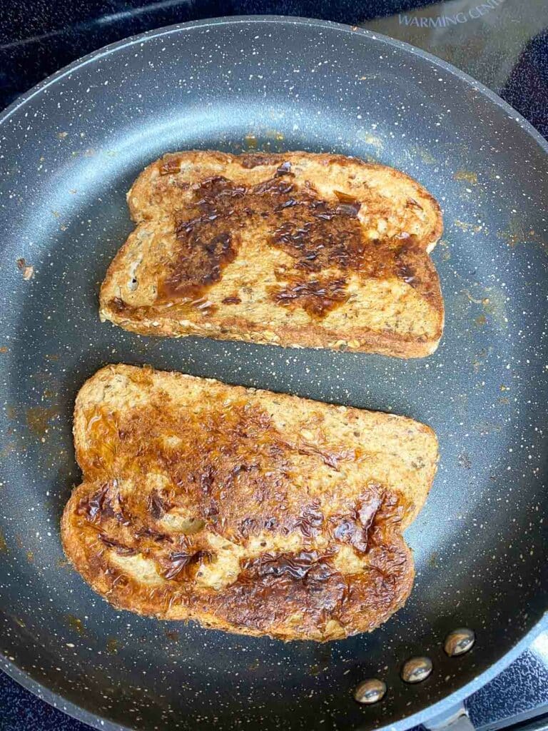 Cooked french toast in nonstick skillet.