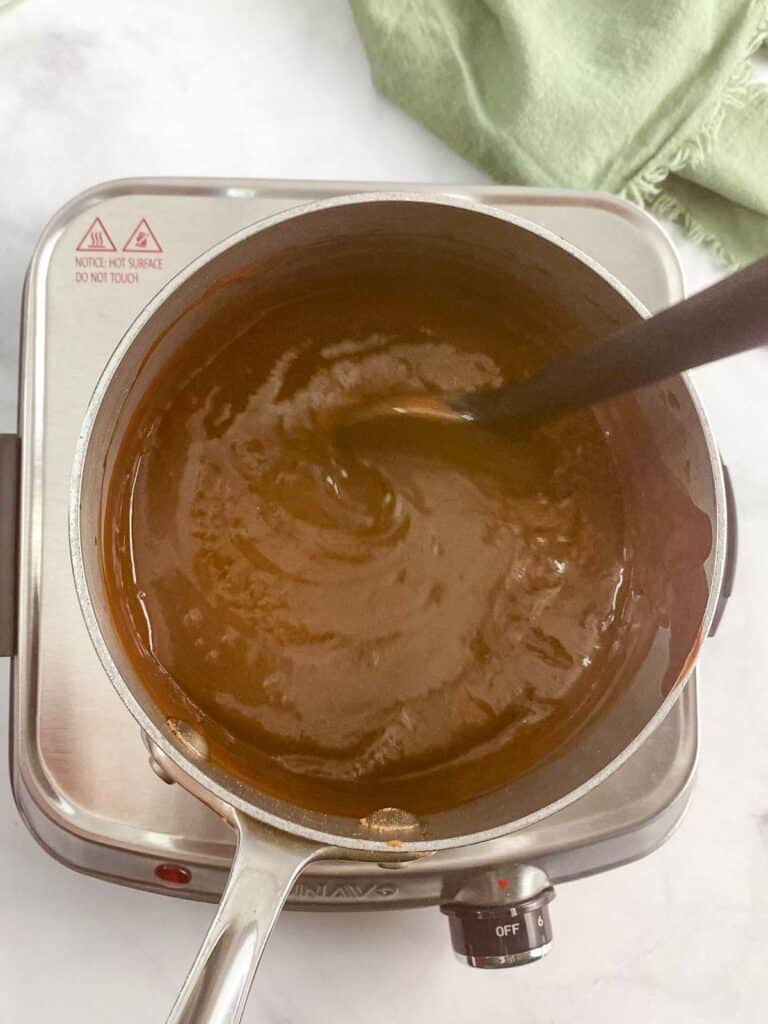 Cooked pudding in a sauce pan.