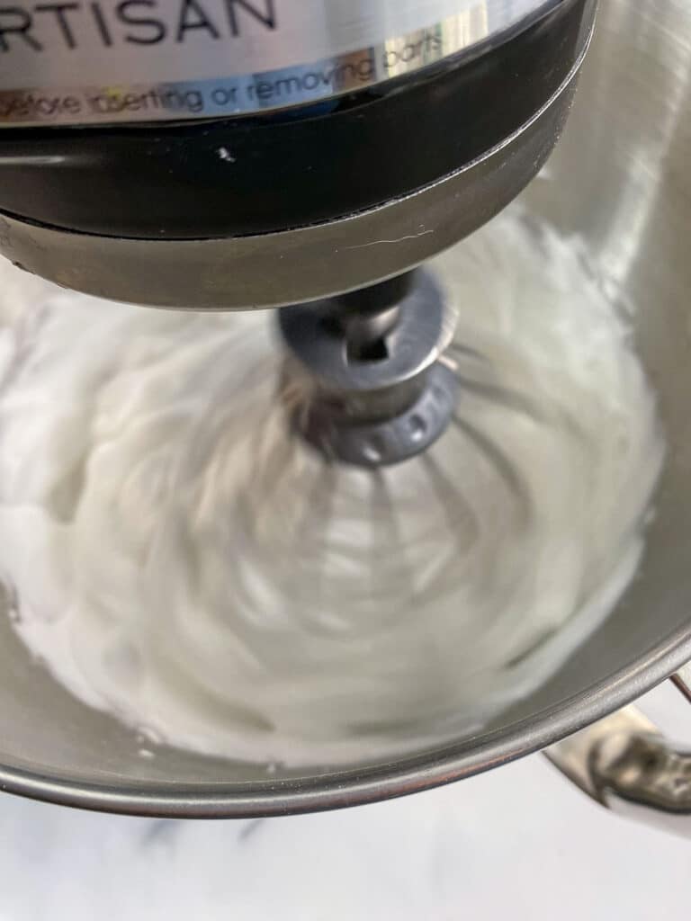 Aquafaba being whipped in stand mixer.