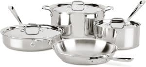 Set of All-Clad stainless steel cookware.