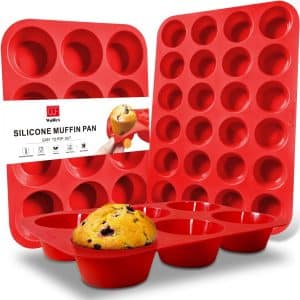 Three red silicone muffin pans in different sizes=