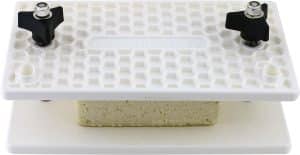 Tofu press pressing tofu.
